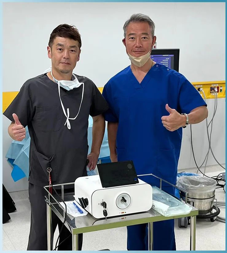 Clinicians with a Pioon diode laser system after a PLDD procedure